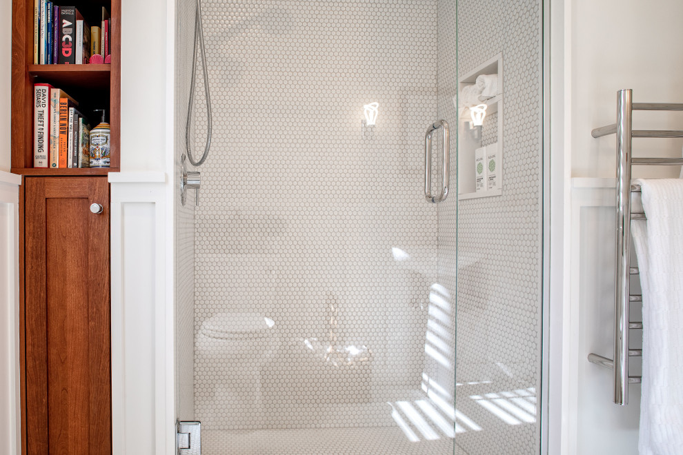 Medium sized classic shower room bathroom in Detroit with white cabinets, an alcove shower, a two-piece toilet, white tiles, mosaic tiles, white walls, mosaic tile flooring, a pedestal sink, white floors, a hinged door, a single sink, a freestanding vanity unit and wainscoting.