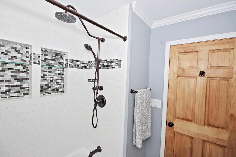 Inspiration for a small traditional shower room bathroom in Chicago with shaker cabinets, beige cabinets, an alcove bath, an alcove shower, a two-piece toilet, white tiles, ceramic tiles, blue walls, ceramic flooring, a submerged sink, engineered stone worktops, brown floors, a shower curtain and grey worktops.