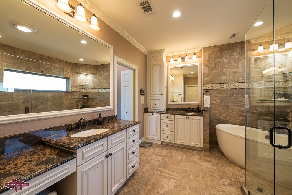 Mid-sized minimalist master beige tile and stone tile ceramic tile bathroom photo in Dallas with raised-panel cabinets, distressed cabinets, a one-piece toilet, beige walls, an undermount sink and granite countertops
