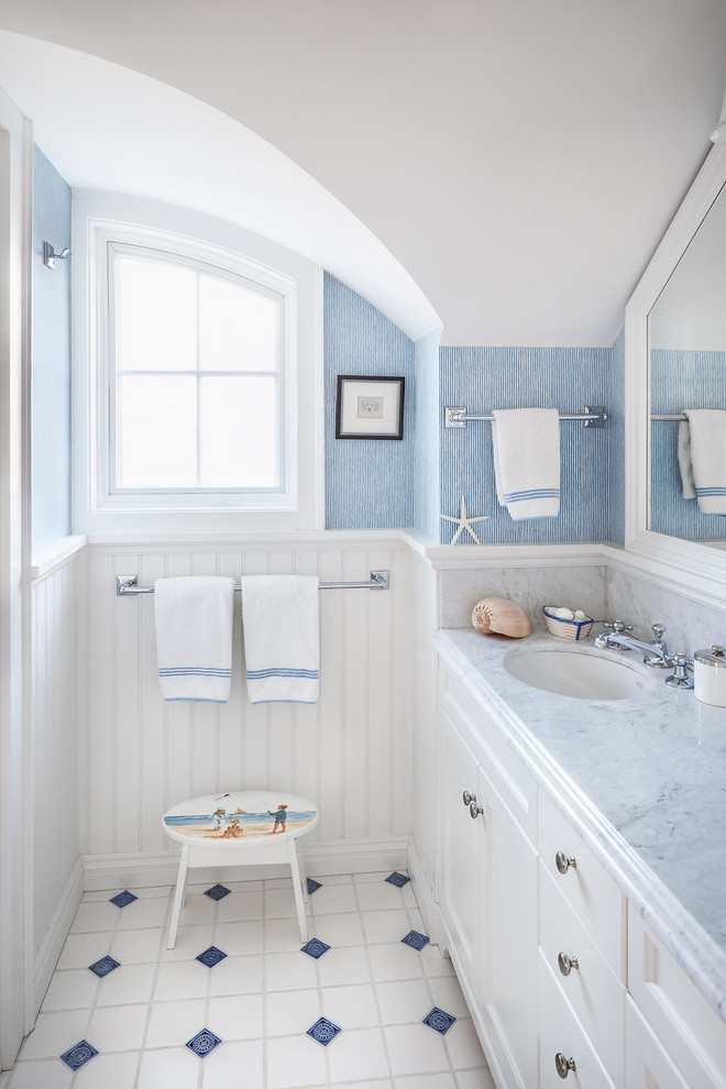 Beach style kids' white tile multicolored floor bathroom photo in Portland Maine with an undermount sink, recessed-panel cabinets, white cabinets, blue walls and gray countertops