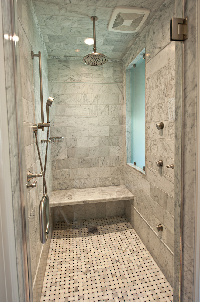 Doorless shower - traditional white tile and stone tile doorless shower idea in Nashville with marble countertops and a wall-mount toilet