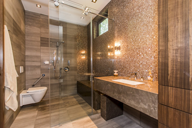 Photo of a medium sized modern shower room bathroom in Toronto with open cabinets, a walk-in shower, a wall mounted toilet, brown tiles, porcelain tiles, brown walls, porcelain flooring, a submerged sink, marble worktops, brown floors, a sliding door and brown worktops.