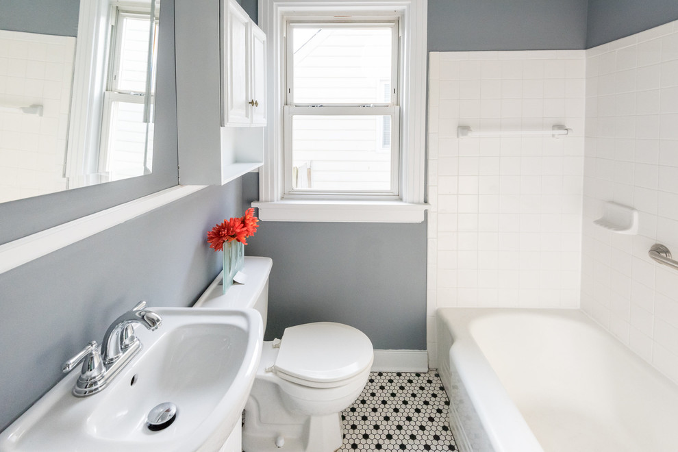 Design ideas for a small contemporary shower room bathroom in Wilmington with a shower/bath combination, raised-panel cabinets, white cabinets, a two-piece toilet, grey walls, mosaic tile flooring and a console sink.