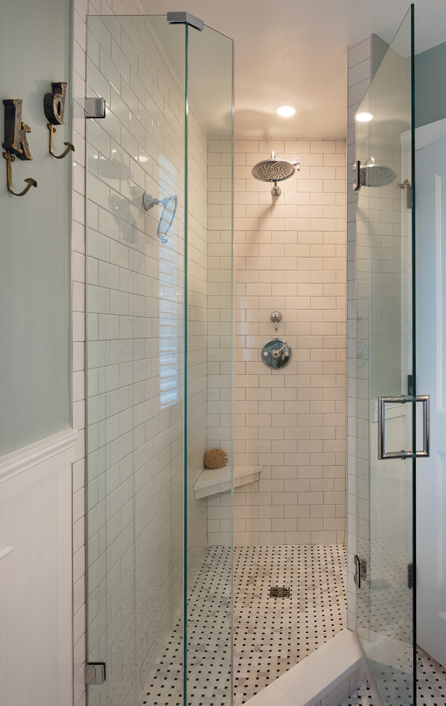 Example of a small transitional master white tile and porcelain tile porcelain tile and white floor corner shower design in DC Metro with blue walls and a hinged shower door
