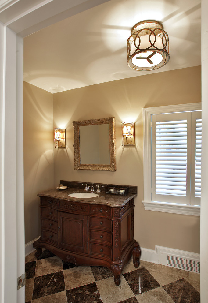 Imagen de cuarto de baño contemporáneo de tamaño medio con lavabo bajoencimera, armarios tipo mueble, puertas de armario de madera en tonos medios, encimera de granito, baldosas y/o azulejos beige, baldosas y/o azulejos de piedra y paredes beige