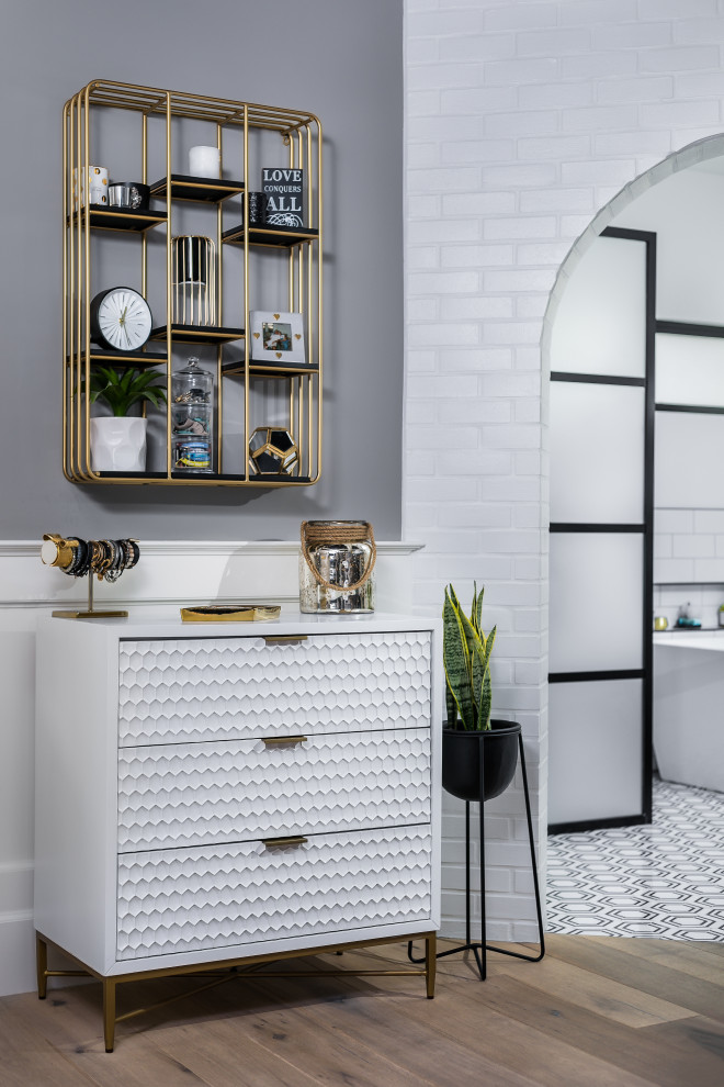 Example of an urban master white tile and porcelain tile medium tone wood floor, brown floor, double-sink and brick wall bathroom design in Phoenix with flat-panel cabinets, white cabinets, white walls, a drop-in sink, quartzite countertops, white countertops and a floating vanity