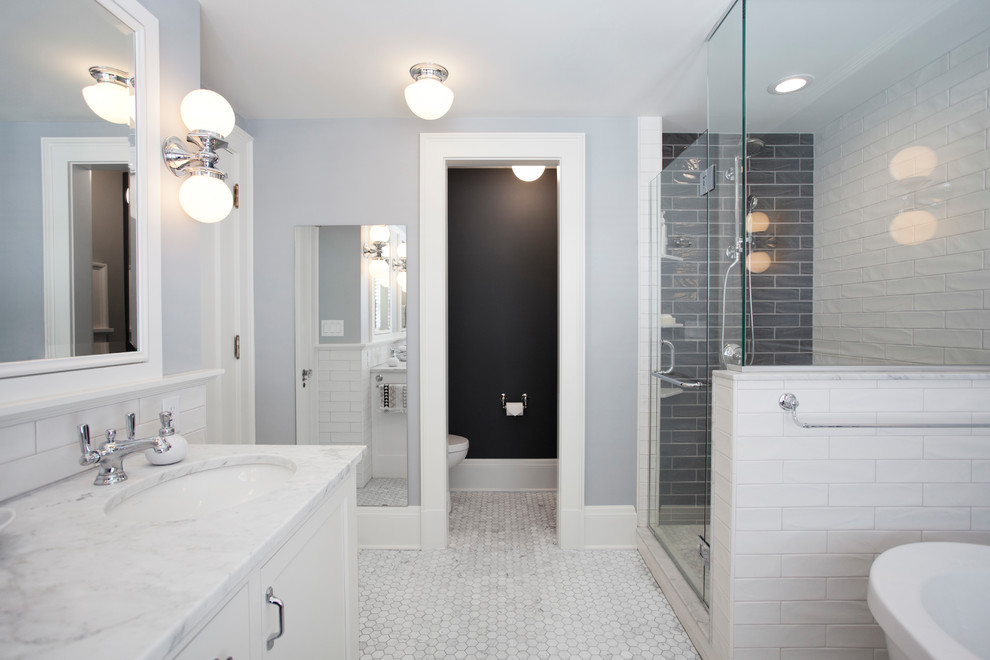 Inspiration for a large timeless master white tile and subway tile marble floor and gray floor bathroom remodel in Minneapolis with recessed-panel cabinets, white cabinets, a one-piece toilet, black walls, an undermount sink, granite countertops and a hinged shower door