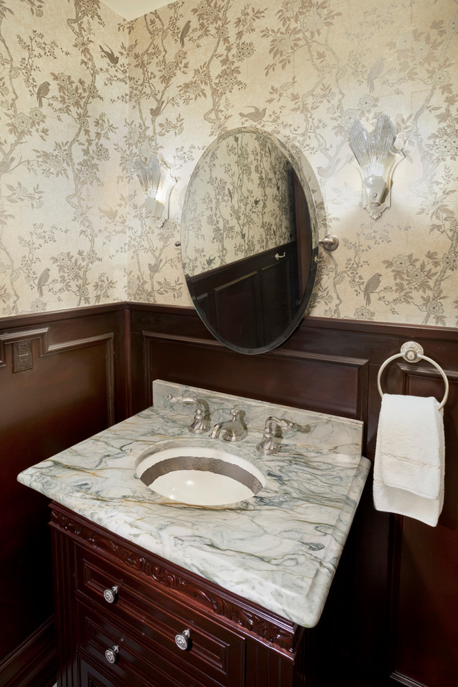 Example of a transitional single-sink bathroom design in Dallas with dark wood cabinets and a built-in vanity