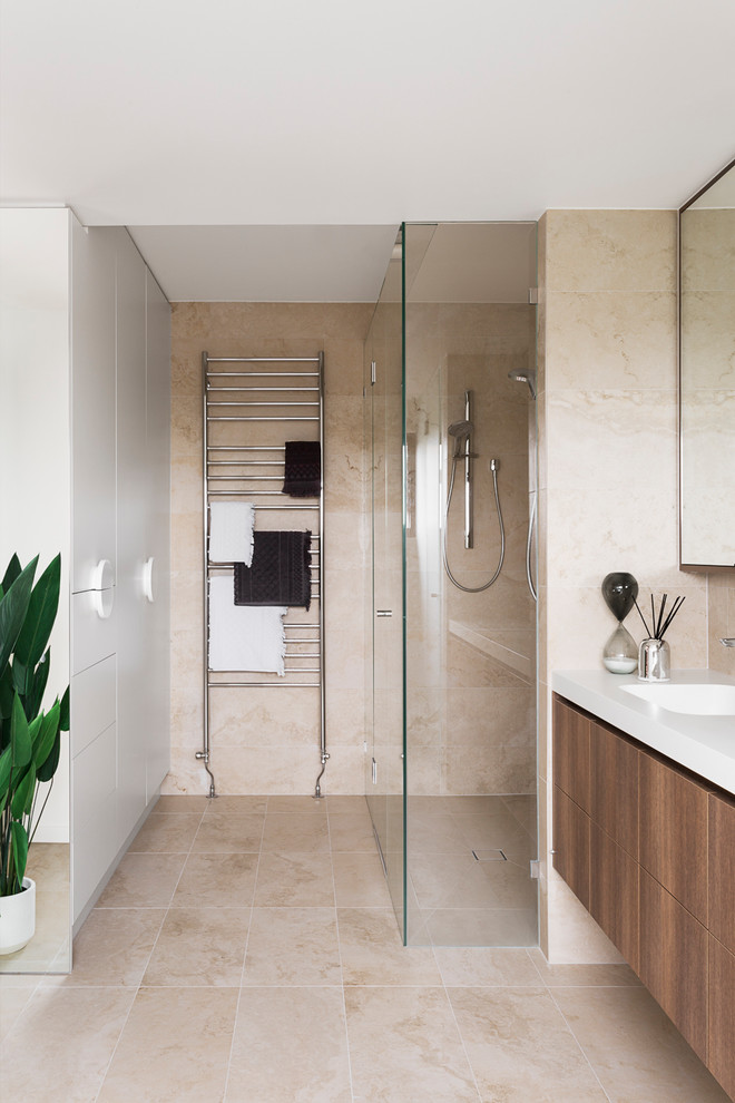 Mid-sized elegant master ceramic tile ceramic tile and multicolored floor bathroom photo in Melbourne with flat-panel cabinets, dark wood cabinets, a two-piece toilet, white walls, a drop-in sink, laminate countertops and white countertops