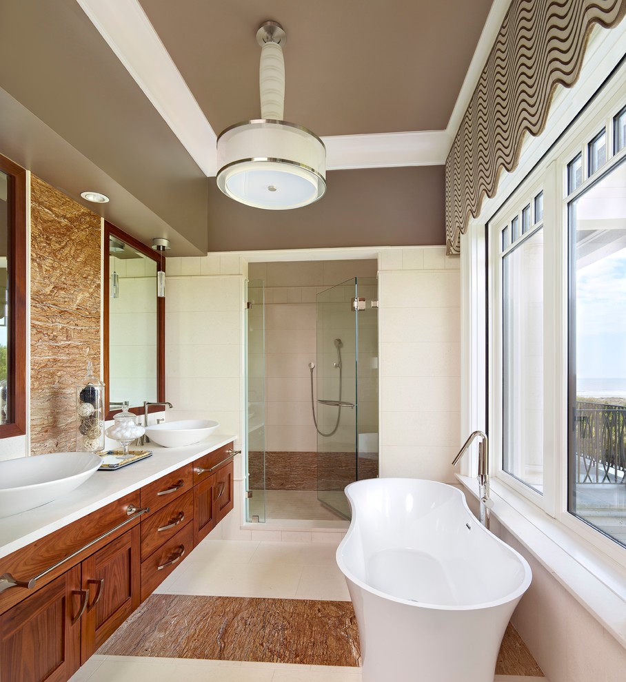 Diseño de cuarto de baño tradicional renovado con lavabo sobreencimera, armarios estilo shaker, puertas de armario de madera oscura, ducha empotrada, baldosas y/o azulejos blancos, paredes marrones y encimeras blancas