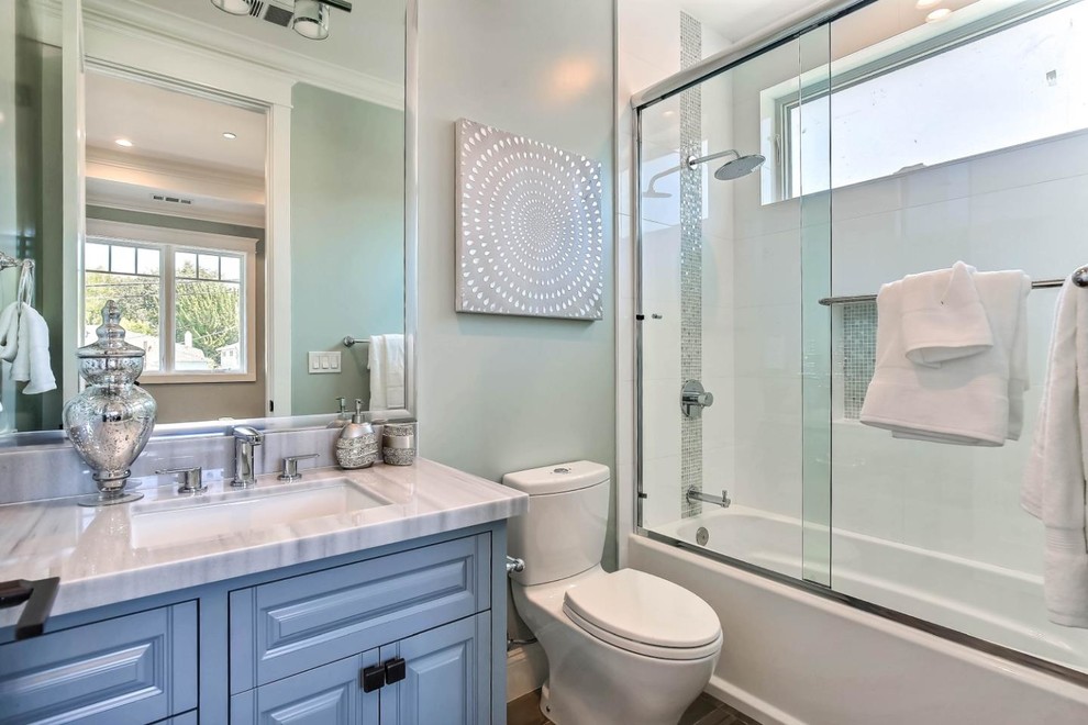 Example of a small arts and crafts kids' white tile and ceramic tile porcelain tile and gray floor bathroom design in San Francisco with raised-panel cabinets, gray cabinets, a two-piece toilet, blue walls, an undermount sink and quartz countertops