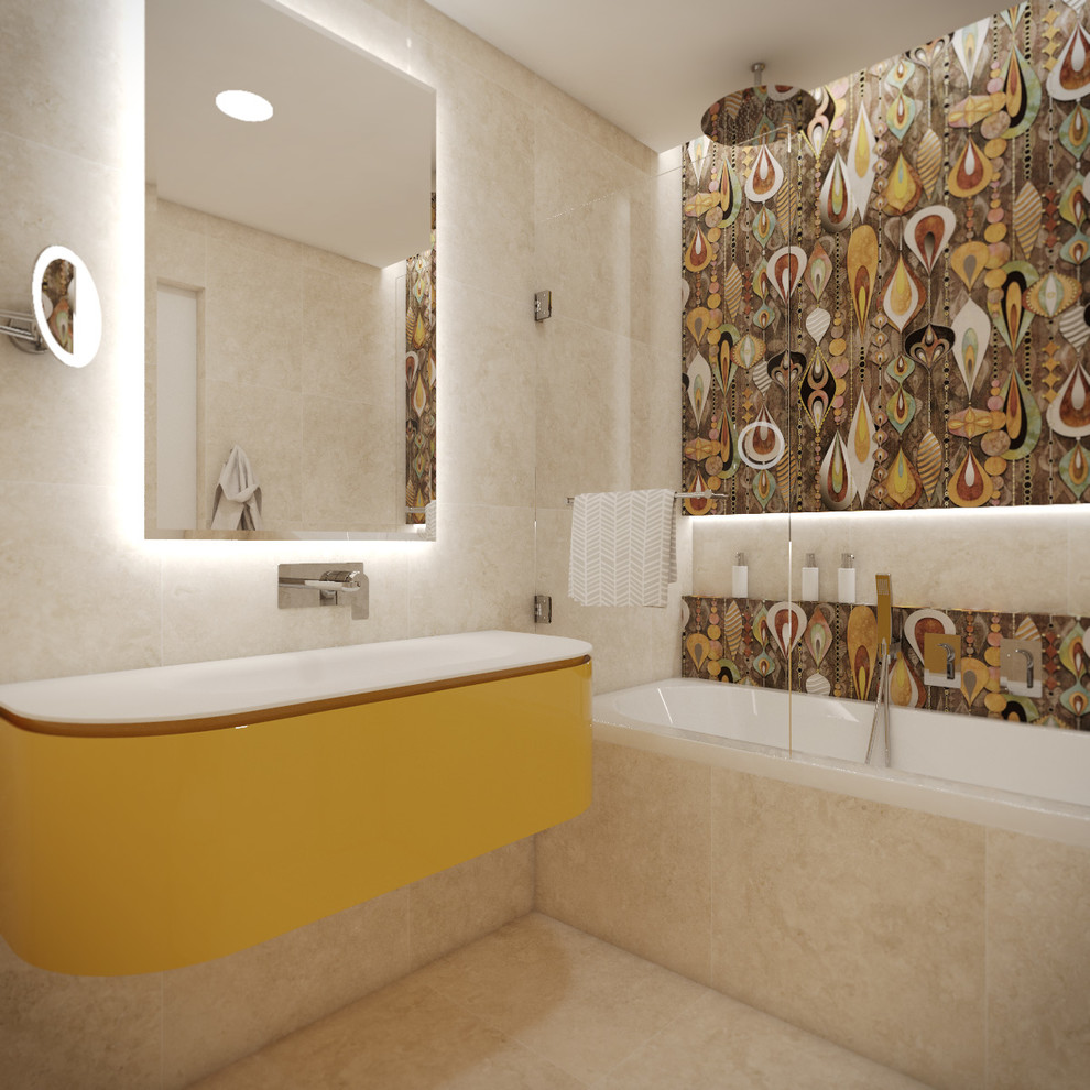 Пример оригинального дизайна: детская ванная комната среднего размера в стиле модернизм с желтыми фасадами, ванной в нише, душем над ванной, разноцветной плиткой, стеклянной столешницей, плоскими фасадами, плиткой из травертина, разноцветными стенами, полом из травертина, консольной раковиной, бежевым полом и душем с распашными дверями