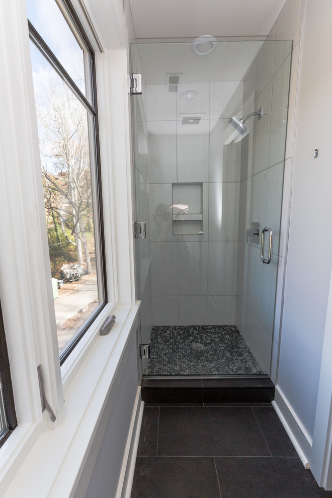 Small modern family bathroom in Other with flat-panel cabinets, grey cabinets, an alcove shower, white tiles, ceramic tiles, white walls and porcelain flooring.