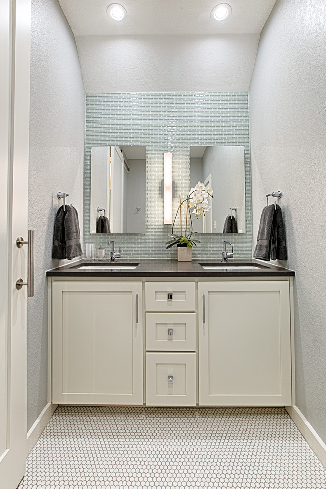 Medium sized contemporary family bathroom in Austin with shaker cabinets, white cabinets, an alcove shower, green tiles, glass tiles, grey walls, mosaic tile flooring, a submerged sink and engineered stone worktops.
