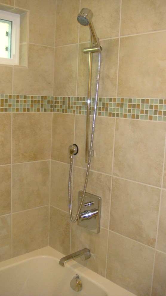 Example of a mid-sized transitional kids' green tile and glass sheet porcelain tile bathroom design in San Francisco with a drop-in sink, shaker cabinets, white cabinets, marble countertops, a two-piece toilet and green walls