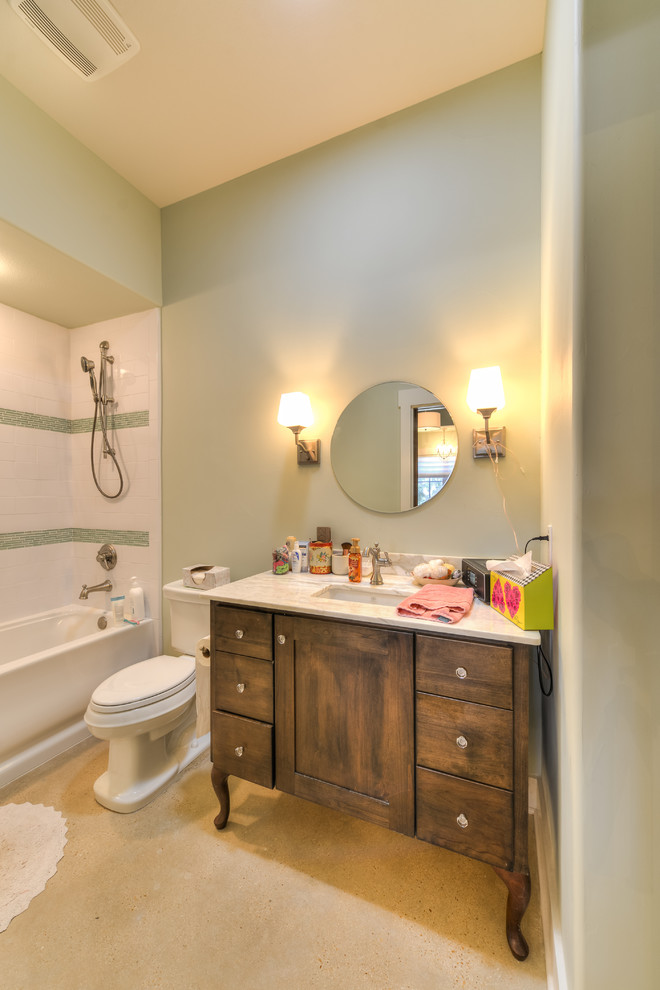 Bathroom - large rustic kids' multicolored tile and ceramic tile concrete floor bathroom idea in Austin with recessed-panel cabinets, light wood cabinets, a one-piece toilet, green walls, an undermount sink and granite countertops