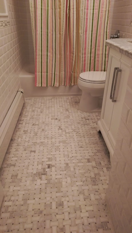 Bathroom - mid-sized traditional kids' white tile and ceramic tile marble floor bathroom idea in New York with an undermount sink, furniture-like cabinets, white cabinets, marble countertops, a two-piece toilet and gray walls