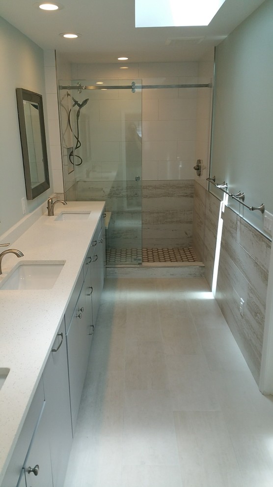 Medium sized vintage family bathroom in Tampa with flat-panel cabinets, grey cabinets, a double shower, white tiles, porcelain tiles, porcelain flooring, a submerged sink, engineered stone worktops, beige floors, a sliding door and multi-coloured worktops.