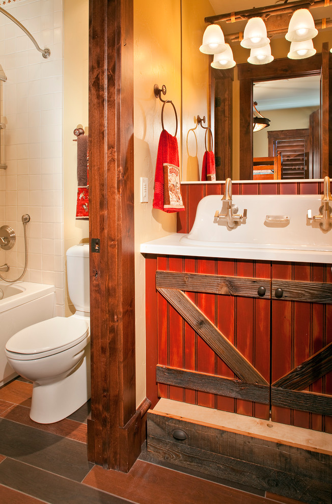 Photo of a medium sized classic family bathroom in Denver with a built-in sink, red cabinets, a shower/bath combination, white tiles, ceramic tiles and beige walls.