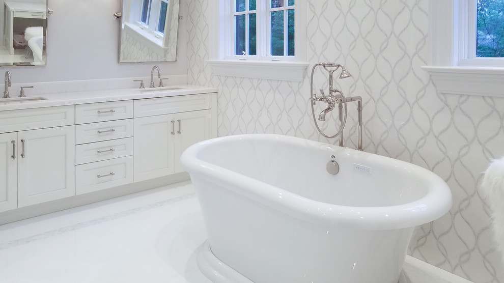 Photo of a large classic ensuite bathroom in New York with white tiles and white floors.