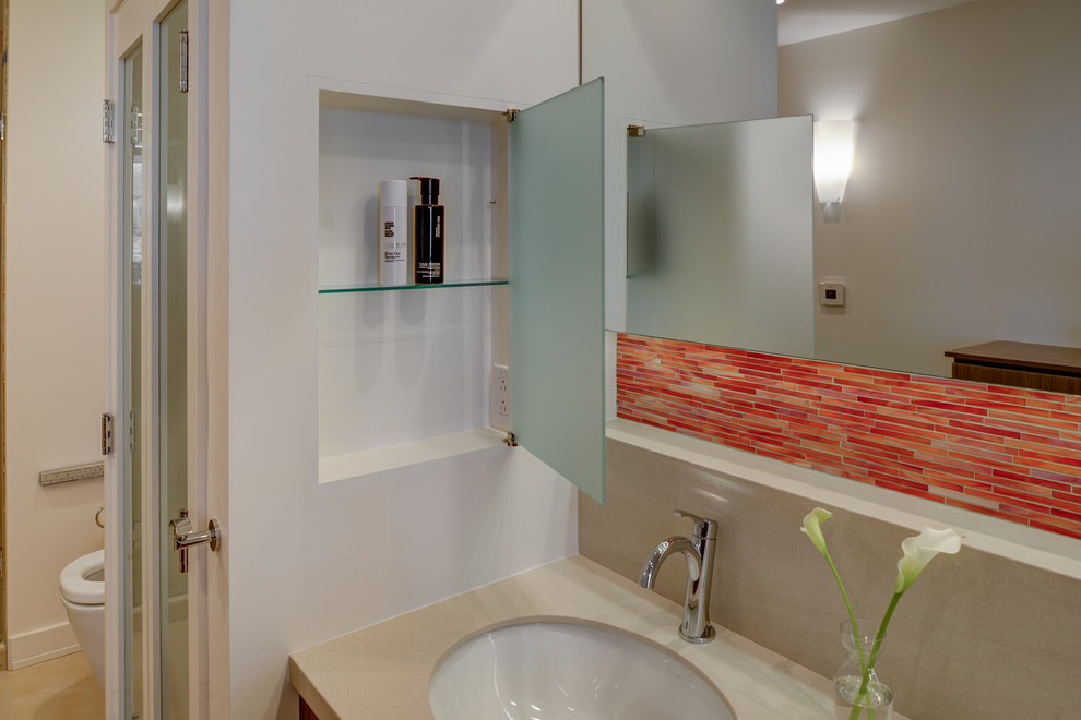 Photo of a traditional bathroom in San Francisco with flat-panel cabinets, medium wood cabinets, mosaic tiles, white walls, porcelain flooring and red tiles.