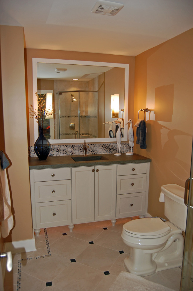 Mid-sized beach style 3/4 blue tile and mosaic tile ceramic tile corner shower photo in Baltimore with an integrated sink, concrete countertops, shaker cabinets, white cabinets, a one-piece toilet and orange walls