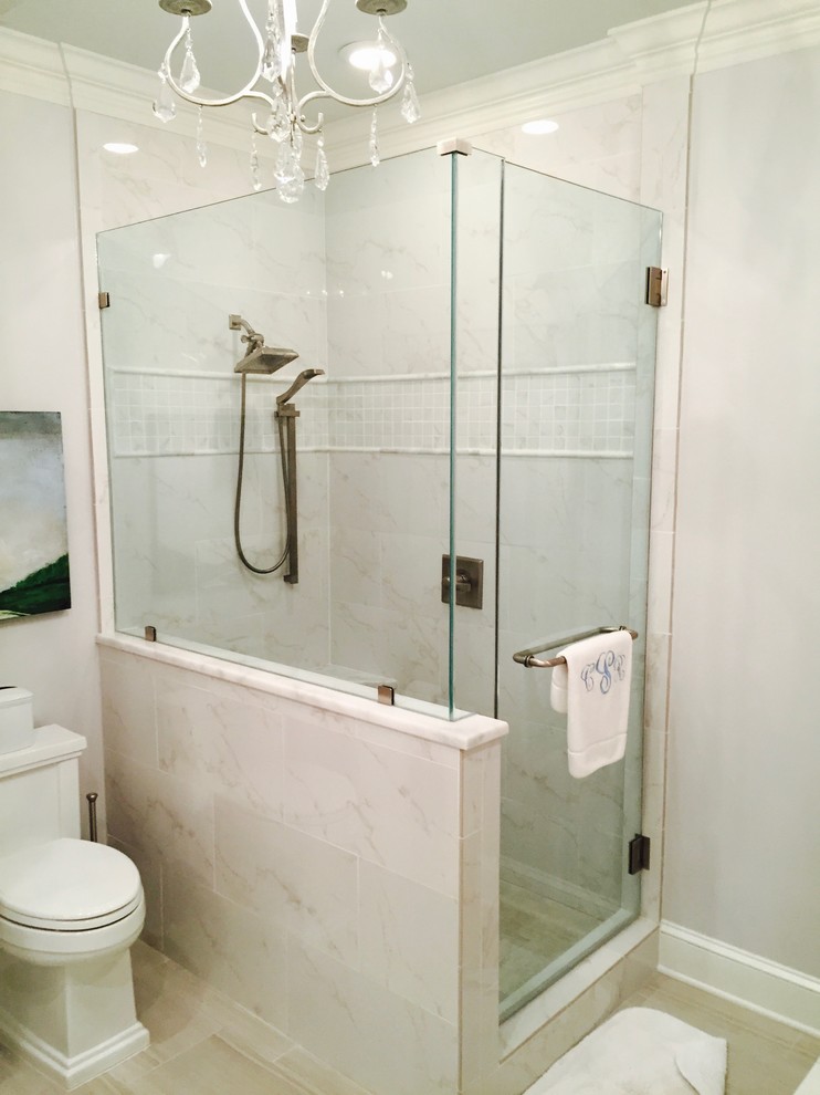 Inspiration for a medium sized traditional ensuite bathroom in Other with recessed-panel cabinets, white cabinets, a two-piece toilet, white tiles, mosaic tiles, pink walls, light hardwood flooring, a submerged sink, marble worktops, beige floors, a hinged door, a built-in bath and a corner shower.