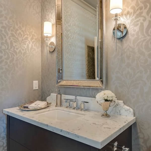 Example of a small transitional master bathroom design in Other with flat-panel cabinets, dark wood cabinets, an integrated sink and marble countertops
