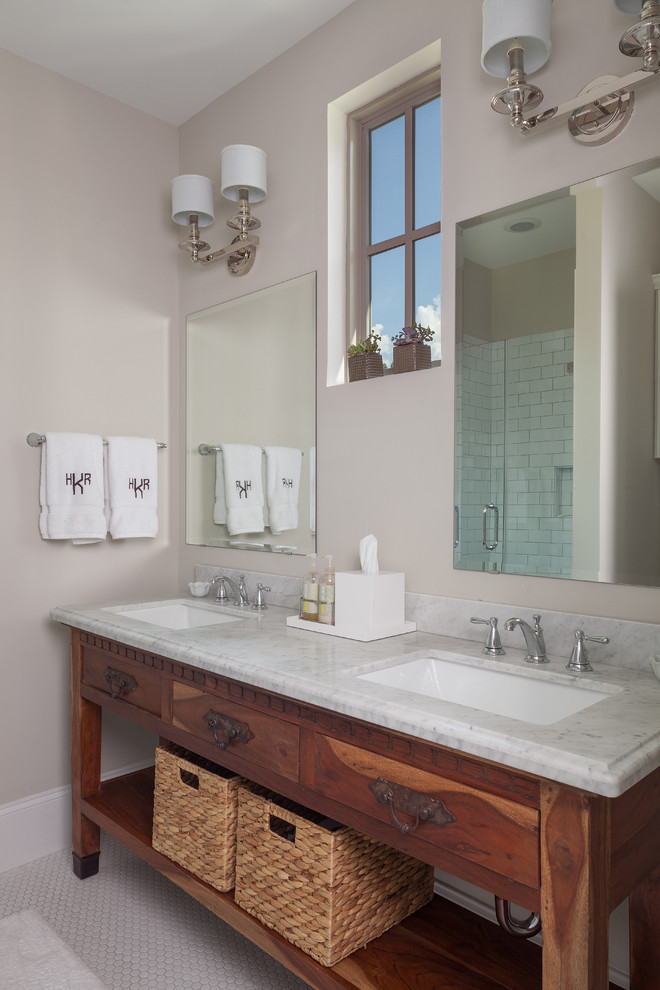 Inspiration for a classic bathroom in Houston with a submerged sink, medium wood cabinets and flat-panel cabinets.