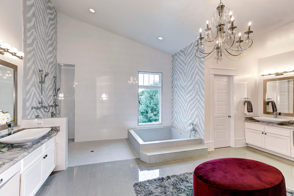 Example of a large transitional master gray tile, white tile and glass tile marble floor doorless shower design in DC Metro with a vessel sink, white cabinets, marble countertops, white walls and recessed-panel cabinets