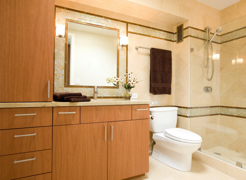 Photo of a medium sized eclectic ensuite bathroom in Hawaii with a submerged sink, flat-panel cabinets, medium wood cabinets, granite worktops, a walk-in shower, a two-piece toilet, beige tiles, porcelain tiles, white walls and porcelain flooring.