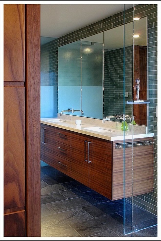 Inspiration for a medium sized contemporary shower room bathroom in San Francisco with a built-in sink, flat-panel cabinets, medium wood cabinets, engineered stone worktops, green walls, ceramic flooring, grey tiles and porcelain tiles.