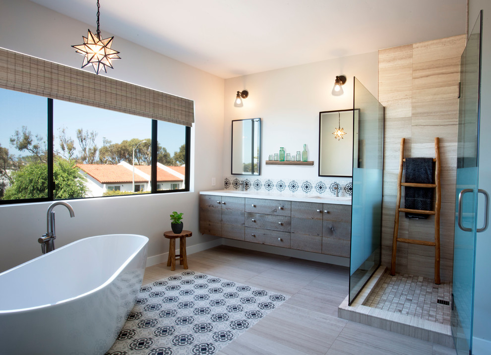 Inspiration for a large rustic master gray tile and cement tile cement tile floor and beige floor bathroom remodel in Denver with flat-panel cabinets, distressed cabinets, a one-piece toilet, an undermount sink, gray walls, quartzite countertops and a hinged shower door