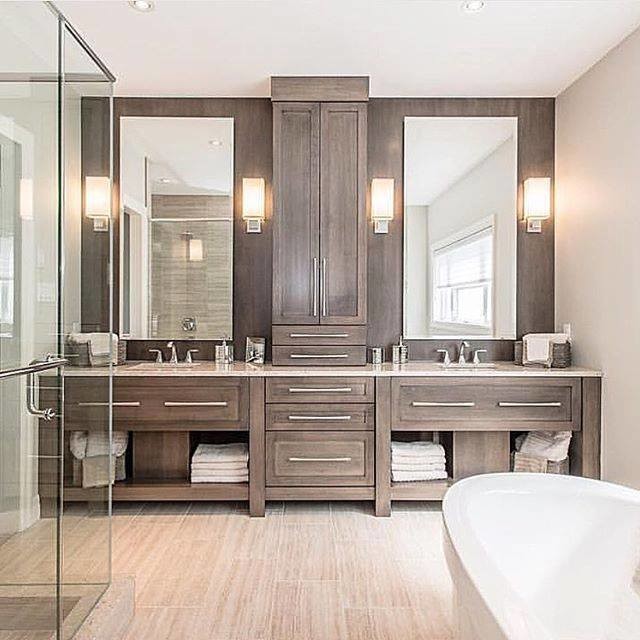 Bathroom - mid-sized contemporary master porcelain tile and beige floor bathroom idea in Los Angeles with flat-panel cabinets, dark wood cabinets, beige walls, an undermount sink, a hinged shower door and beige countertops