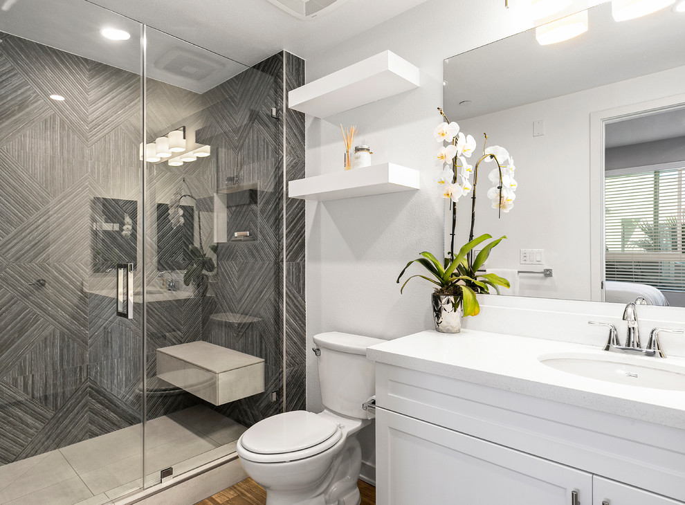 Medium sized traditional ensuite bathroom in Los Angeles with shaker cabinets, white cabinets, grey tiles, porcelain tiles, white walls, porcelain flooring, engineered stone worktops and white worktops.