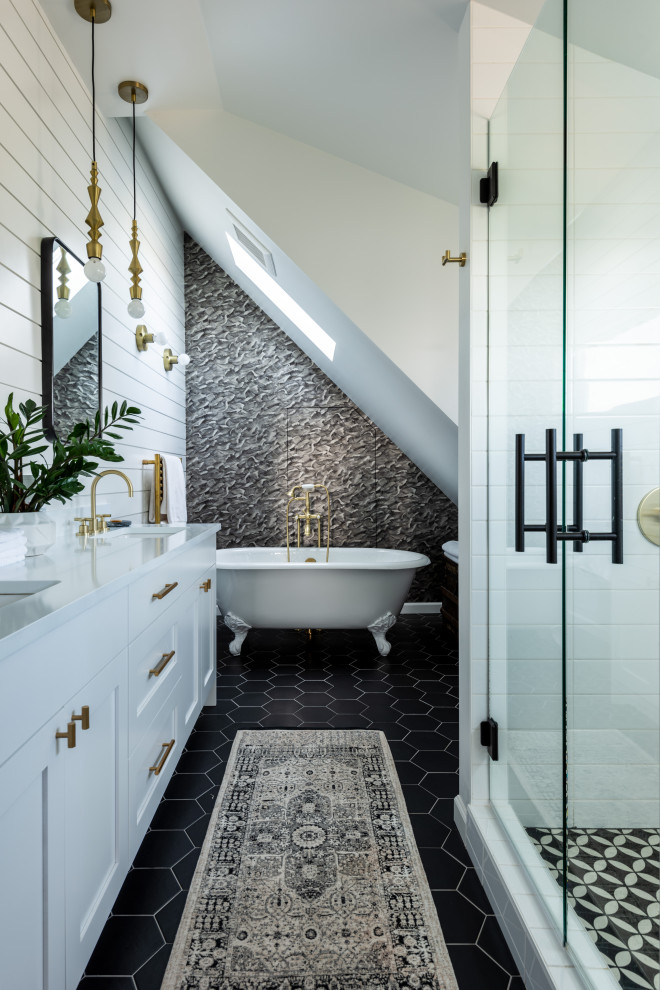 Traditional bathroom in Seattle with shaker cabinets, white cabinets, a claw-foot bath, an alcove shower, grey tiles, white walls, a submerged sink, black floors, a hinged door, white worktops, double sinks, a built in vanity unit, a vaulted ceiling and tongue and groove walls.