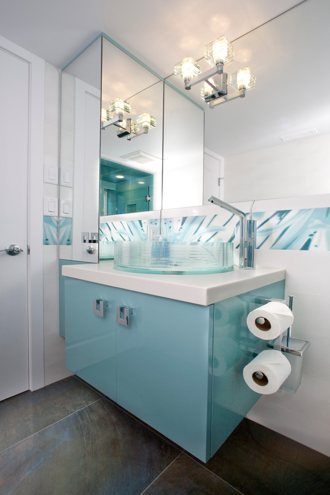 Design ideas for a modern bathroom in Vancouver with a vessel sink, blue cabinets and feature lighting.