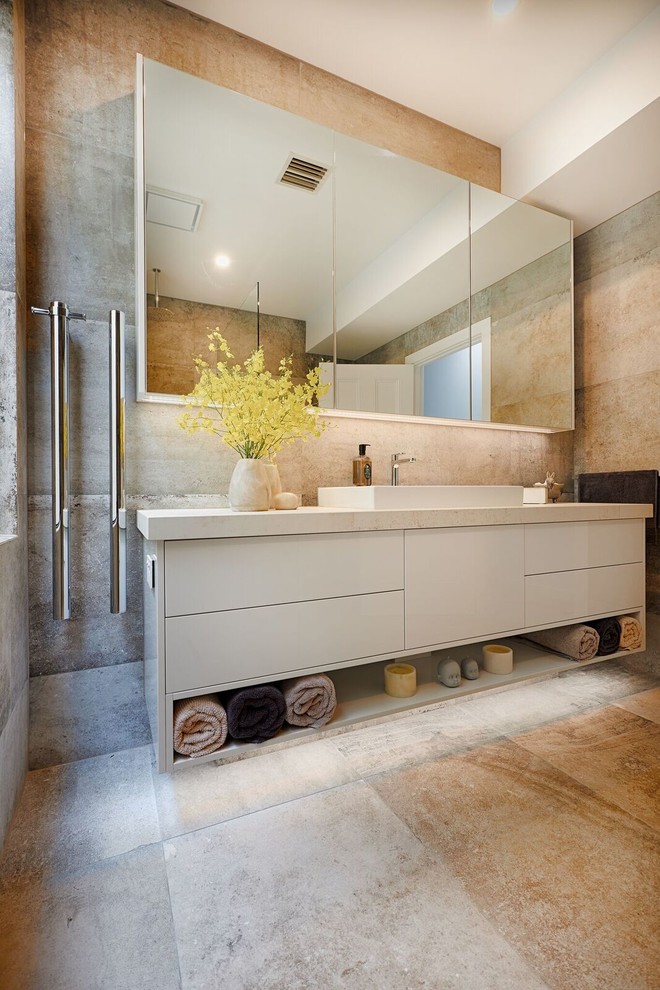 This is an example of a contemporary bathroom in Melbourne with white cabinets, brown tiles, porcelain tiles, porcelain flooring, solid surface worktops, brown floors and beige worktops.