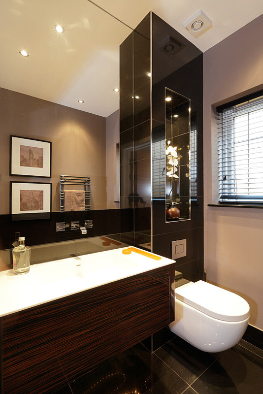 Design ideas for a small modern bathroom in London with a wall mounted toilet and porcelain flooring.