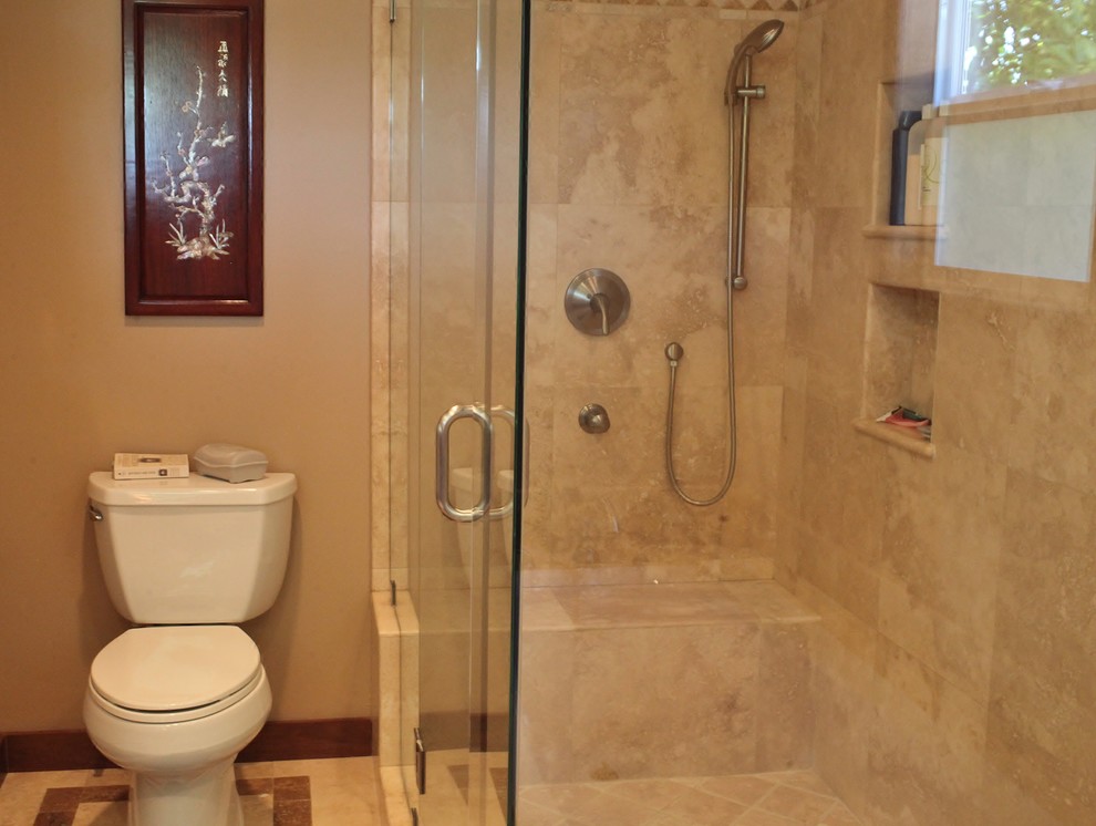 Example of a mid-sized classic 3/4 stone tile travertine floor corner shower design in Los Angeles with an undermount sink, granite countertops, a two-piece toilet and beige walls