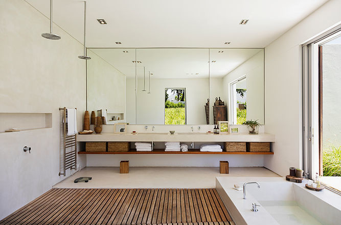 Photo of a large world-inspired ensuite bathroom in San Francisco with open cabinets, a corner bath, white walls, an integrated sink and a walk-in shower.