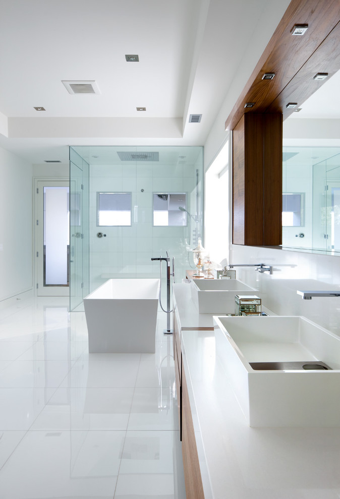 Bathroom - contemporary master white floor bathroom idea in Toronto with flat-panel cabinets, dark wood cabinets, white walls, a vessel sink and a hinged shower door