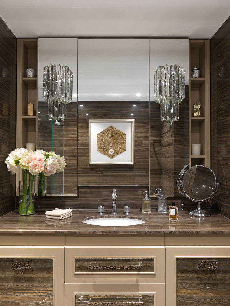 Contemporary bathroom in London with a submerged sink, brown worktops, recessed-panel cabinets, beige cabinets and brown tiles.
