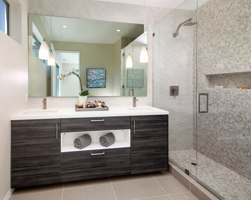 Example of a mid-sized trendy 3/4 beige tile and porcelain tile porcelain tile doorless shower design in Los Angeles with flat-panel cabinets, dark wood cabinets, beige walls and an undermount sink