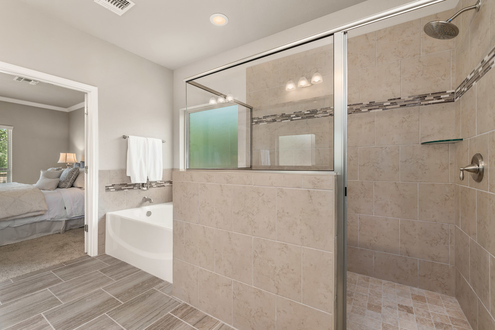 This is an example of a large traditional ensuite bathroom in Austin with recessed-panel cabinets, white cabinets, an alcove bath, a double shower, a two-piece toilet, beige tiles, ceramic tiles, beige walls, ceramic flooring, a submerged sink, granite worktops, beige floors, a hinged door and beige worktops.