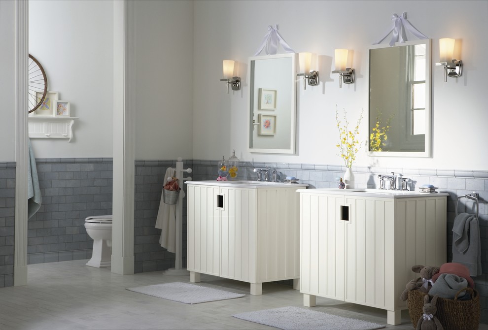 Mid-sized transitional kids' gray tile and ceramic tile porcelain tile bathroom photo in Boston with furniture-like cabinets, white cabinets, a two-piece toilet, white walls and an integrated sink