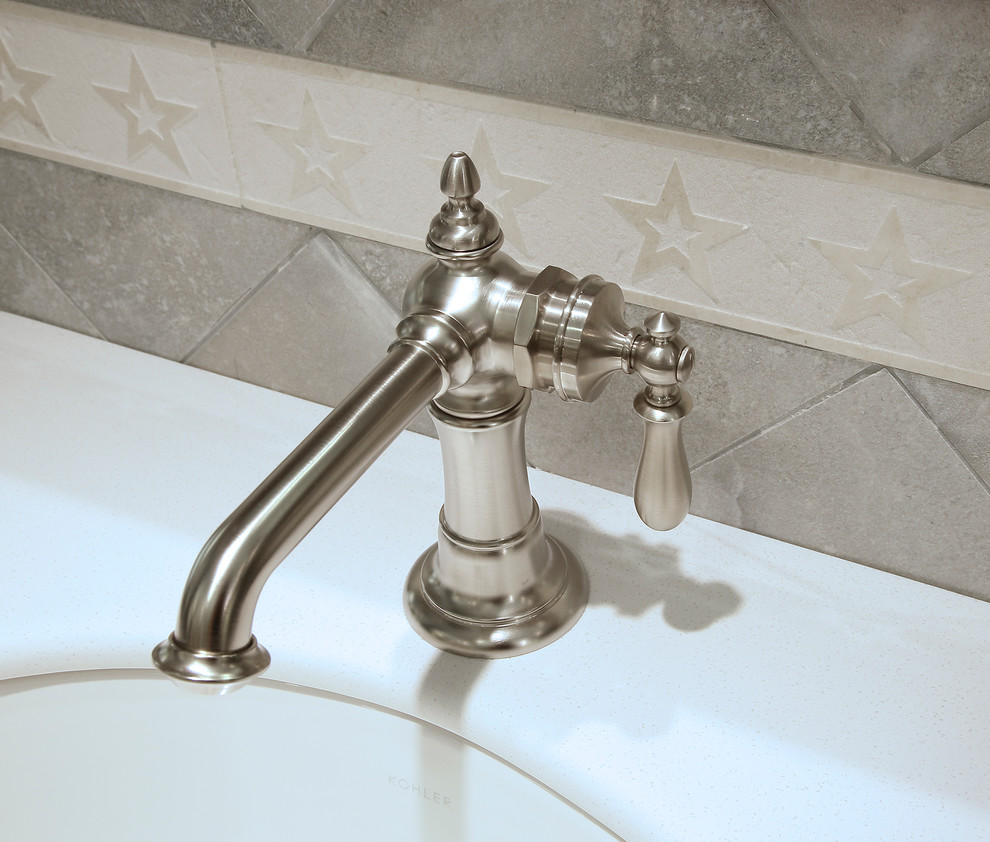 Mid-sized arts and crafts 3/4 blue tile bathroom photo in New York with shaker cabinets, an undermount sink and medium tone wood cabinets