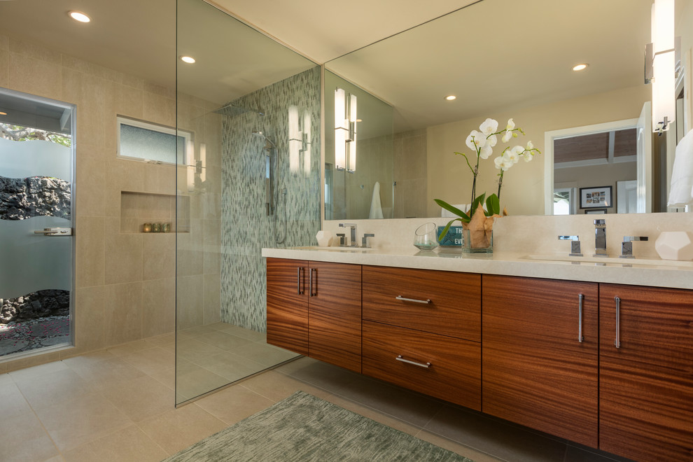 Inspiration for a medium sized world-inspired ensuite bathroom in Hawaii with flat-panel cabinets, brown cabinets, a corner shower, beige walls, ceramic flooring, a built-in sink, engineered stone worktops, beige floors and an open shower.