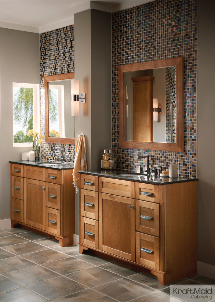 Foto de cuarto de baño actual de tamaño medio con armarios con paneles empotrados, puertas de armario de madera oscura, encimera de granito y baldosas y/o azulejos multicolor