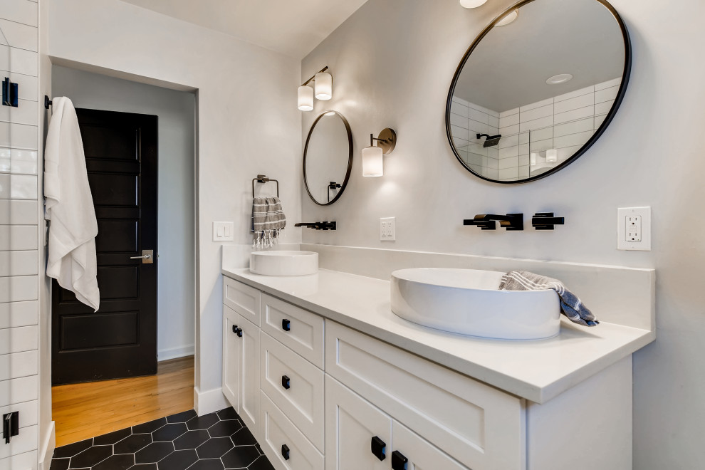 Mid-sized country master white tile and subway tile porcelain tile, black floor and double-sink double shower photo in Denver with shaker cabinets, white cabinets, a two-piece toilet, gray walls, a vessel sink, quartz countertops, a hinged shower door, white countertops, a niche and a built-in vanity